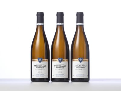 three bottles of wine sitting on top of a table