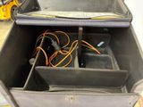 an open suitcase with a bunch of wires inside of it