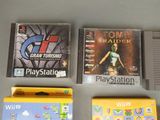 three video games on the table next to each other