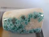 a soap that is sitting on top of a metal tray