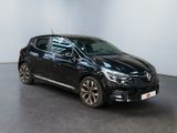 the black car is parked in a white room with a black floor