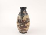 a small vase with a painting on it sitting on a table