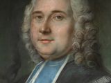 portrait of a man in a black coat with a blue sash
