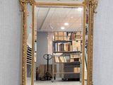 an image of a gold framed mirror sitting on the floor