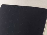 a black and white picture of a laptop on a table