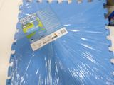 a blue mat that has been wrapped in plastic