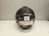 an image of a helmet with a sticker on it sitting on a table