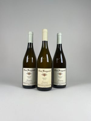 three bottles of wine sitting next to each other on a table