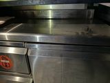 a large stainless steel oven with a sign on it