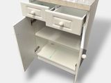 a white cabinet with two drawers and a marble top