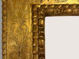 an image of a gold frame with a decorative design on it