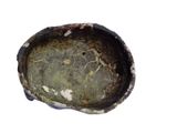 a close up of a small bowl on a white surface