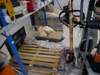 a small room with a lot of items on the shelves