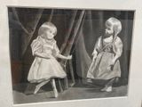 a picture of two children in a picture frame