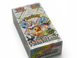 a box of pokemon trading cards on a white surface