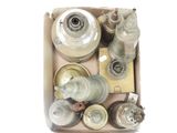 a box full of old metal items on a white surface