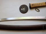 a knife and a knife rest on a table