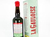 a bottle of alcohol sitting next to a box