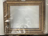 a picture frame that is wrapped in plastic and sitting on a chair