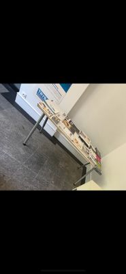 a table that has a bunch of magazines on it