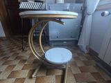 a small table with a stool on it in the kitchen