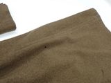 two pieces of brown fabric on a white surface