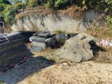 a pile of garbage sitting on the side of the road