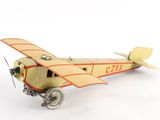 a toy airplane that is sitting on a white surface