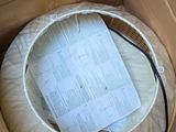 a cardboard box that has a mattress inside of it