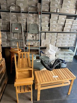 two wooden chairs and a table in a room
