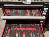 a lot of tools in the drawer of a tool box