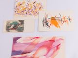 several paintings of different colors and shapes are displayed on a white surface