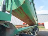 an image of a large green truck with a flat bed