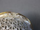 close up of a decorative glass ball with a pattern on it