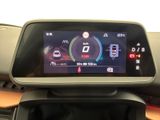 the dashboard of a car with a digital display on it