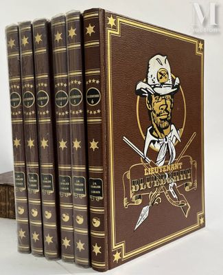 Les trois livres sont alignés les uns à côté des autres sur une surface blanche.