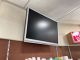 a flat screen tv mounted on the wall in a room