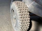 a close up of a vehicle with a plastic cover on it