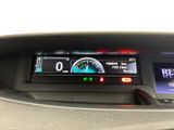 a car dashboard with a speedometer and a digital display