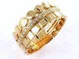 a close up of a gold ring with diamonds on it