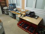 a desk with a lot of electronics on top of it
