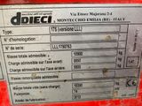 the label on the back of a red tractor shows the date of the vehicle