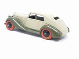 a toy car that is sitting on a white surface