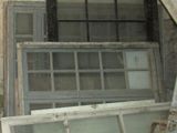 a room with several windows and a door in it