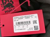 a red tag on the back of a black jacket