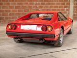 a red car that is parked in a garage