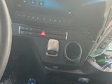 a picture of a car dashboard with a steering wheel