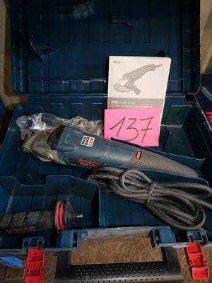 a blue tool box with a corded cord and a tool in it