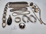 an assortment of silver jewelry including rings, bracelets, rings, and other items
