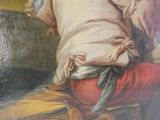 un tableau représentant une femme assise sur un canapé